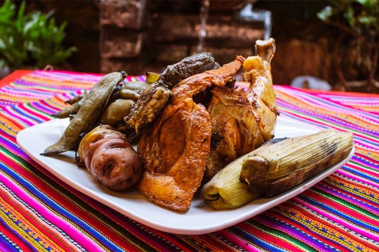 Display of fundamental Peruvian culinary ingredients including fresh citrus, diverse native chilies, and herbs | Ile Tours