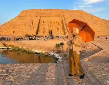 Mature tourists enjoying an uncrowded view of the Great Temple of Abu Simbel in the morning | Ile Tours