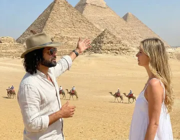 Private Egyptologist welcoming tourists off a Nile cruise ship smoothly | Ile Tours