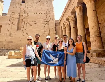 Relaxed tourists arriving at Philae Temple by private boat | Ile Tours