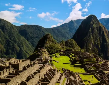 Machu Picchu ruins with terraces and stone structures in the Andes | Ile Tours