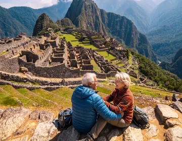 Senior travelers at Machu Picchu Mountain viewpoint with panoramic Andes landscape | Ile Tours