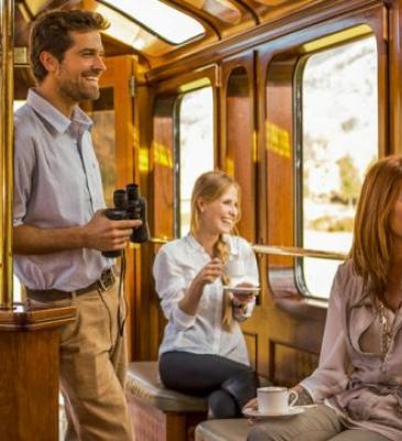 Tourists enjoying train ride to MachuPicchu | Ile Tours