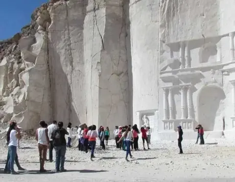 Large sillar sculpture of a horse and rider in Arequipa | Ile Tours